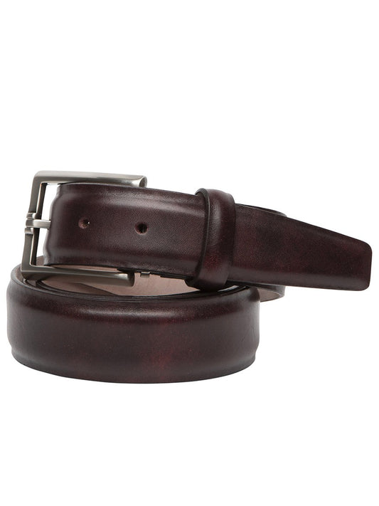 A rolled-up plum-colored Italian marbled calf belt with a silver buckle, handcrafted in the USA from vegetable-dyed materials.