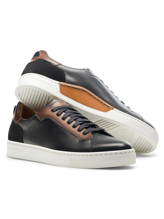 A contemporary pair of Magnanni Amadeo sneakers in Black/Brown with luxury brown soles.