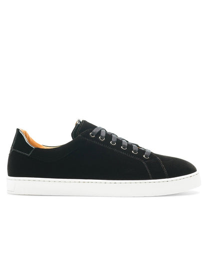 The Magnanni Dalia III in Black Velvet fashion sneaker features a black suede upper and a white sole.