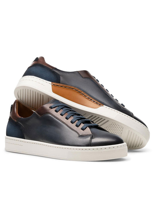 A pair of Magnanni Amadeo in Navy & Brown contemporary cupsole fashion sneakers with blue leather uppers and brown soles.
