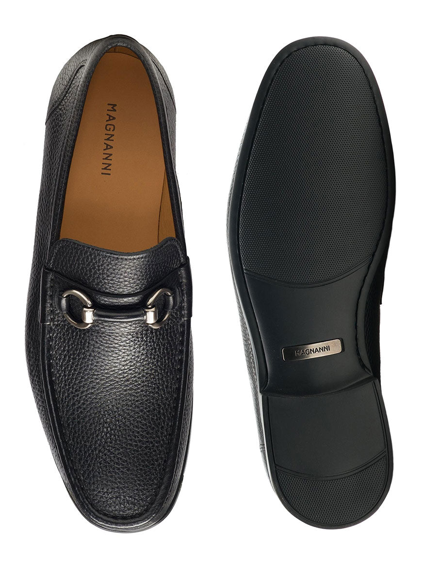 A pair of Magnanni Blas III in Black loafers with a metal buckle and cushioned rubber sole.
