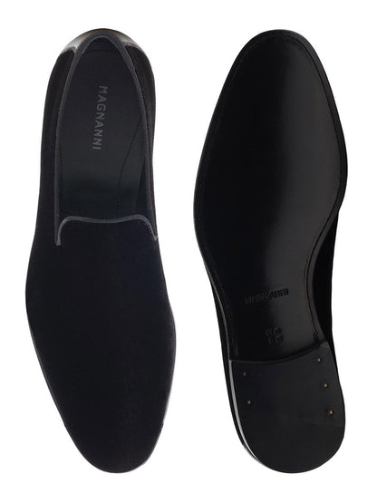 A pair of Magnanni Jareth in Black Velvet slipper loafers on a white background.
