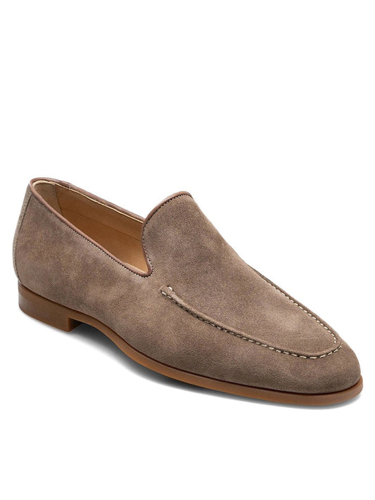 A single, brown suede venetian apron toe loafer with a low heel and visible stitching detail across the top and around the sides, placed against a white background. The shoe features Magnanni Lecera in Torba Suede construction for flexibility and comfort.
