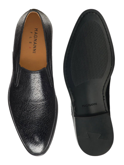 Top view of a black Magnanni Lima loafer crafted from exotic peccary leather, next to its sole showing brand markings and tread design.