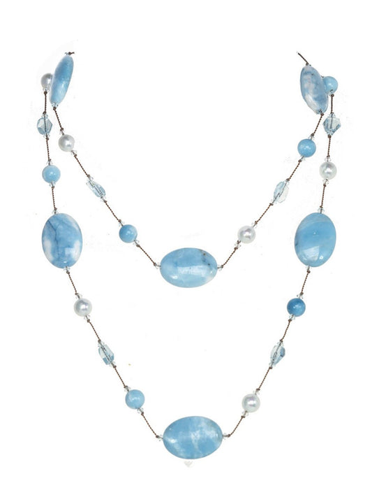 A Margo Morrison Oval Blue Larimar necklace with Blue Topaz and white shell pearl beaded necklace isolated on a white background.