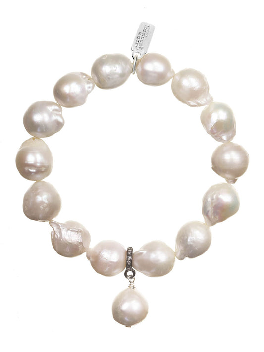 Margo Morrison White Baroque Pearl Stretch Bracelet with a single baroque pearl pendant and sterling silver clasp on a white background.