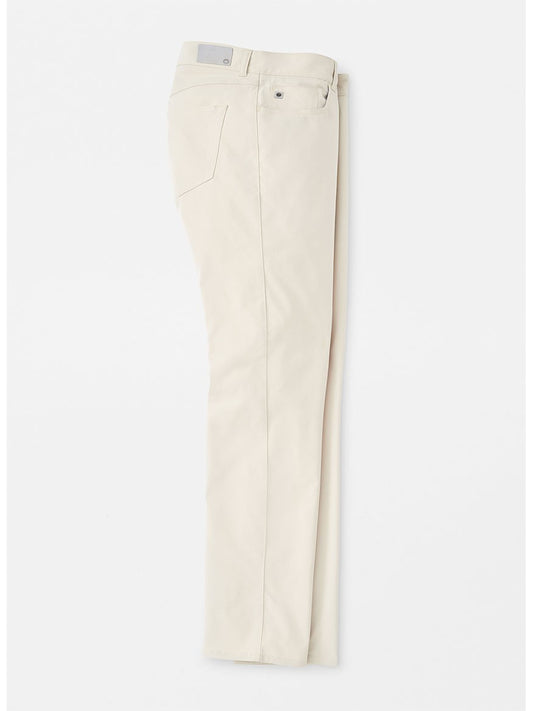 A single Peter Millar Performance Five-Pocket Pant in Stone with visible button and pockets, displayed flat on a white background.