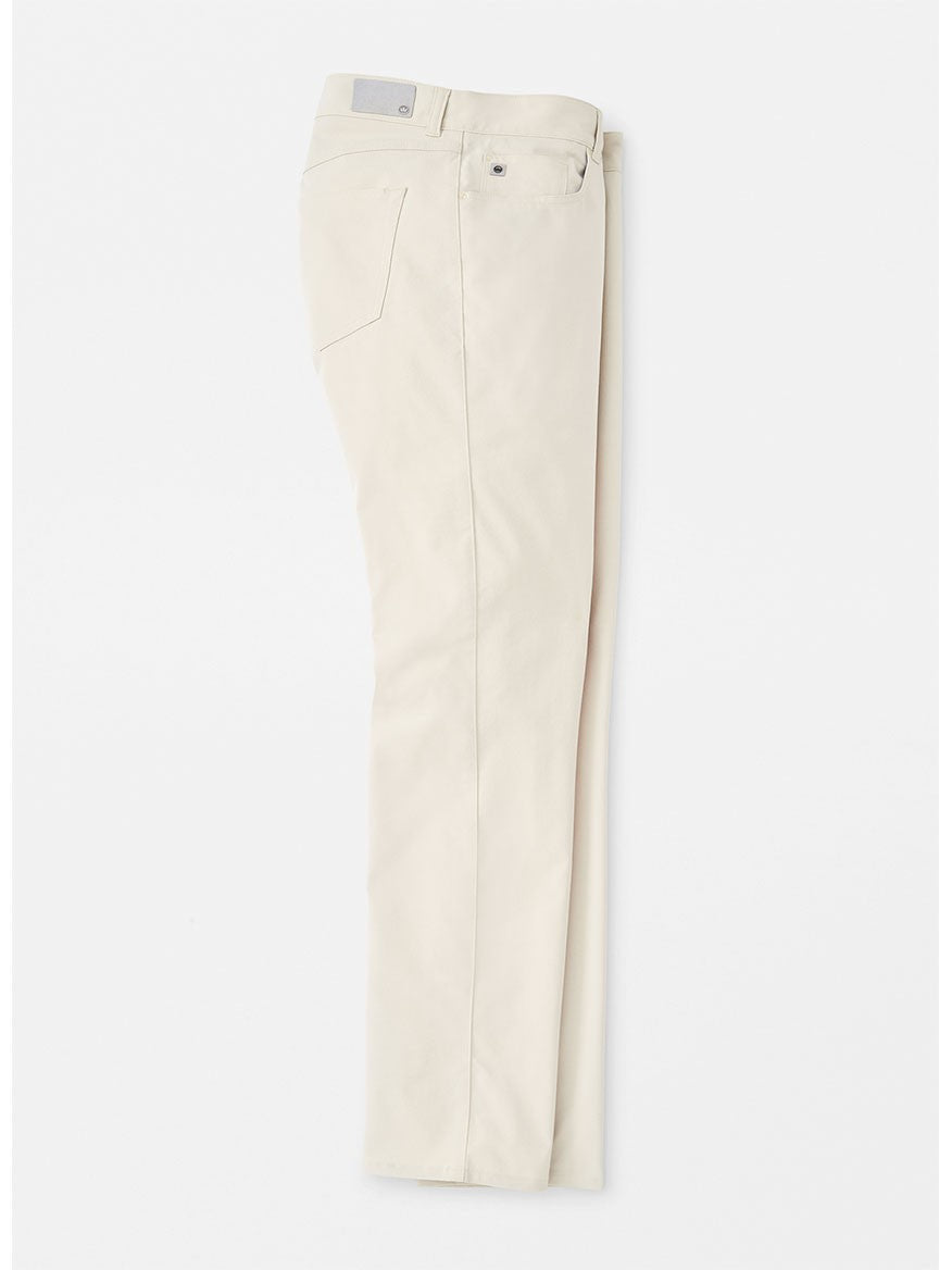 A single Peter Millar Performance Five-Pocket Pant in Stone with visible button and pockets, displayed flat on a white background.