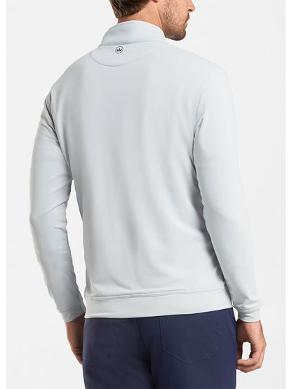 The back view of a man wearing a Peter Millar Perth Performance Quarter-Zip in British Grey, designed by Peter Millar.