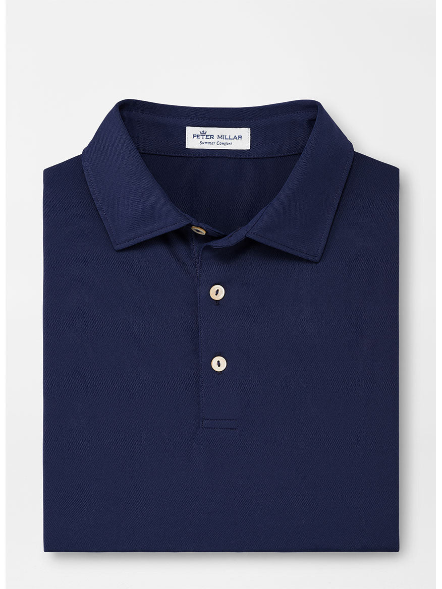The Peter Millar Solid Performance Mesh Polo in Navy is a lightweight, comfortable shirt featuring a collared design with three buttons and the Peter Millar label inside the neckline.