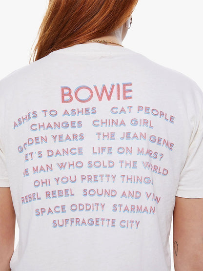 Rear view of a person wearing Mother Denim The Grab Bag Crop in Rebel Rebel with a list of David Bowie song titles printed in various colors.