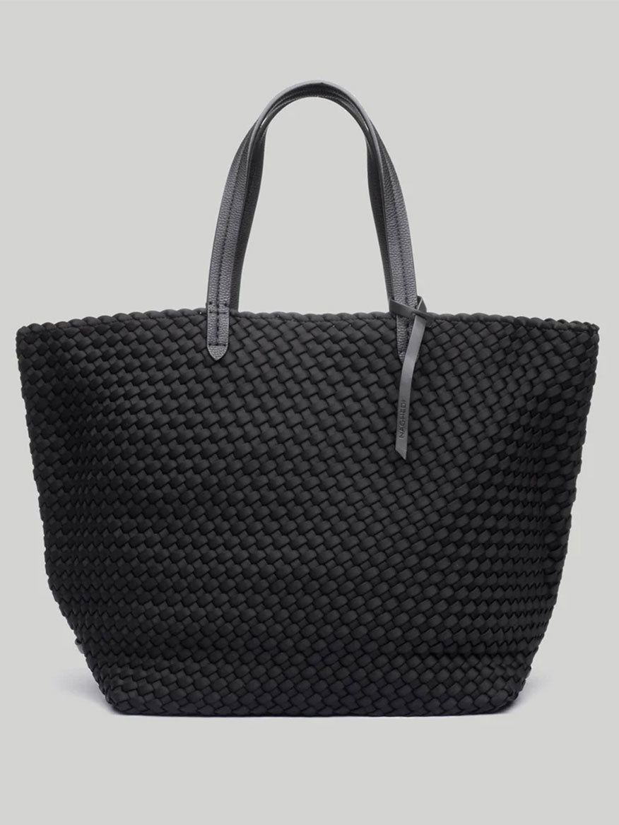 Introducing the Naghedi Jet Setter Large Tote in Solid Onyx: a spacious black woven tote bag with sporty nylon lining and two stylish gray handles, set against a light gray background—ideal for travel.