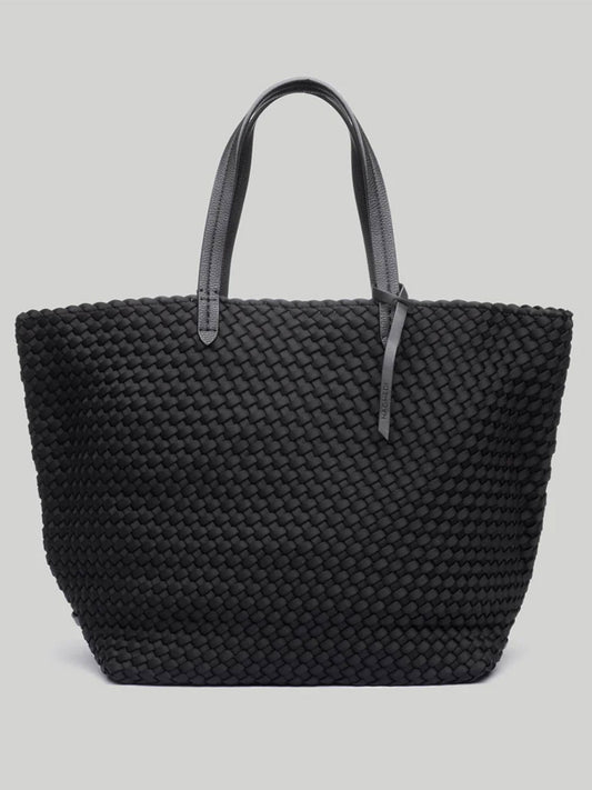 Introducing the Naghedi Jet Setter Large Tote in Solid Onyx: a spacious black woven tote bag with sporty nylon lining and two stylish gray handles, set against a light gray background—ideal for travel.
