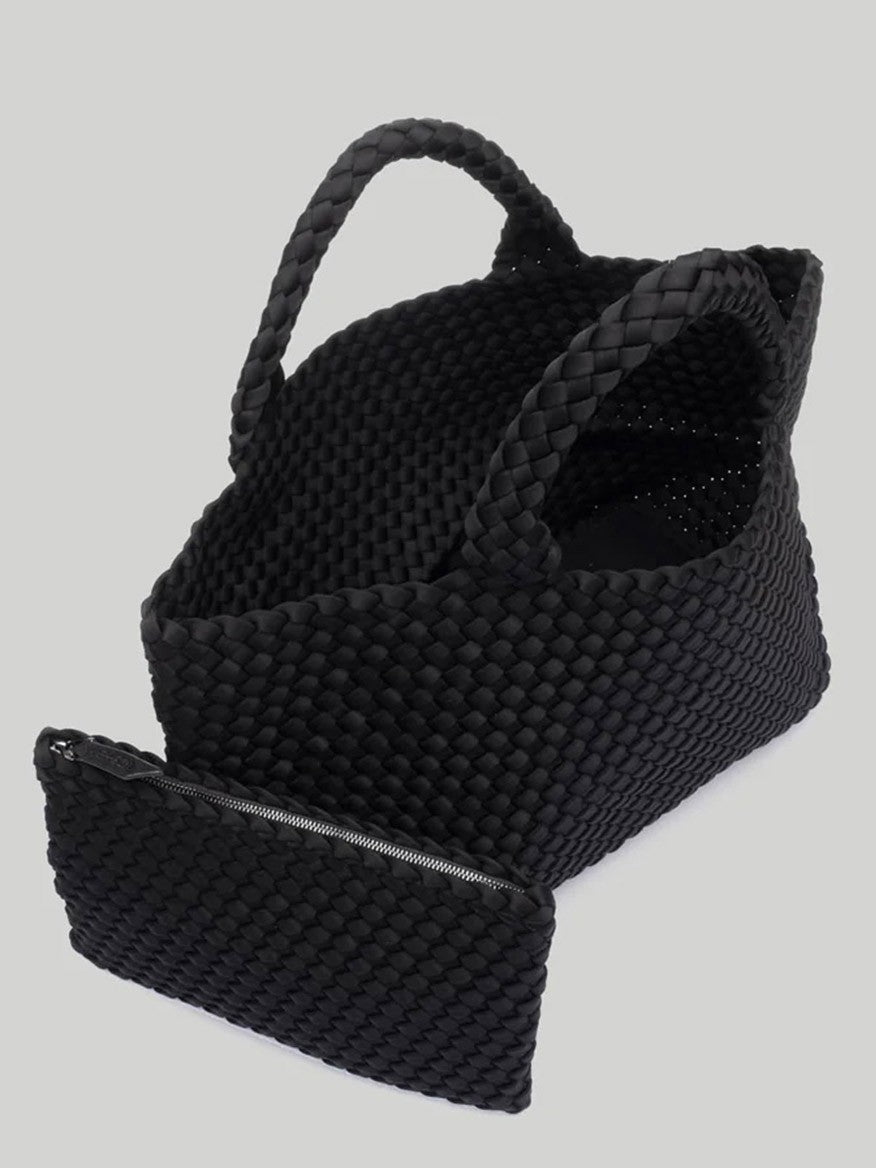 Naghedi St. Barths Medium Tote in Solid Onyx handwoven neoprene tote bag with matching pouch against a grey background.