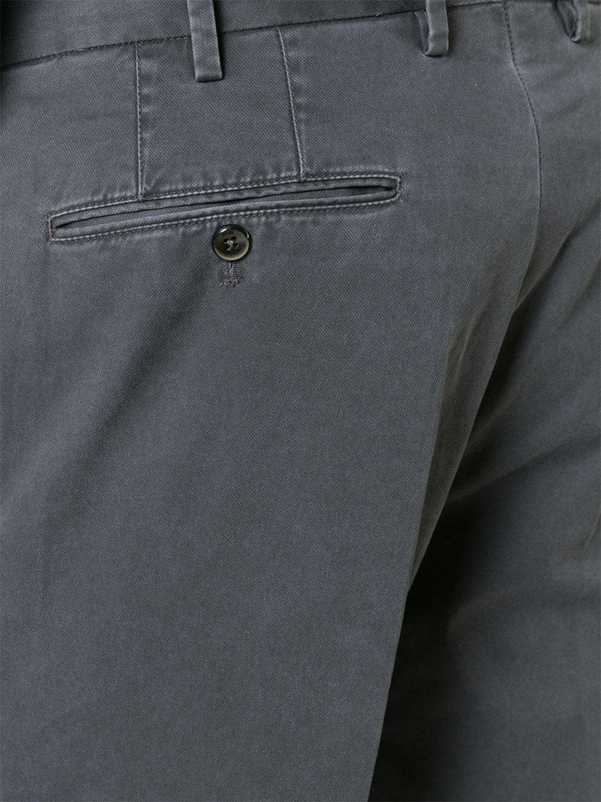 Close-up of the back pocket and waistband of a pair of PT01 Délavé Tricotine Stretch Trousers in Grey, with a single button on the pocket.