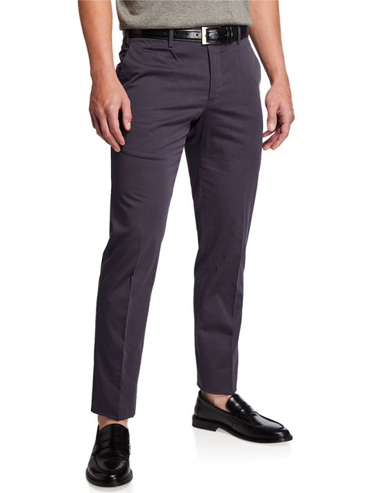 A man is showcasing a chic look with navy PT01 SilkOchino Stretch Trousers, a gray belt, and black loafers, standing against a white background.