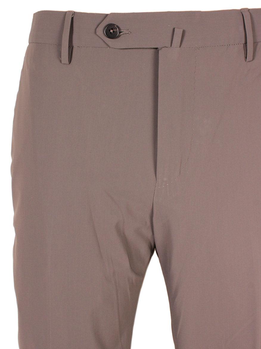 Close-up of the PT01 Kinetic Active Lux Trouser in Tan, featuring a button closure and belt loops. The fabric appears smooth with minimal wrinkling, perfect for a sleek look.