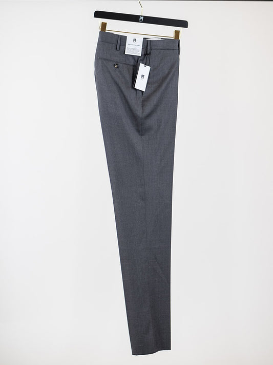 A PT01 Estrato 120s Lux Wool Twill Trouser in Black hanging on a hanger.