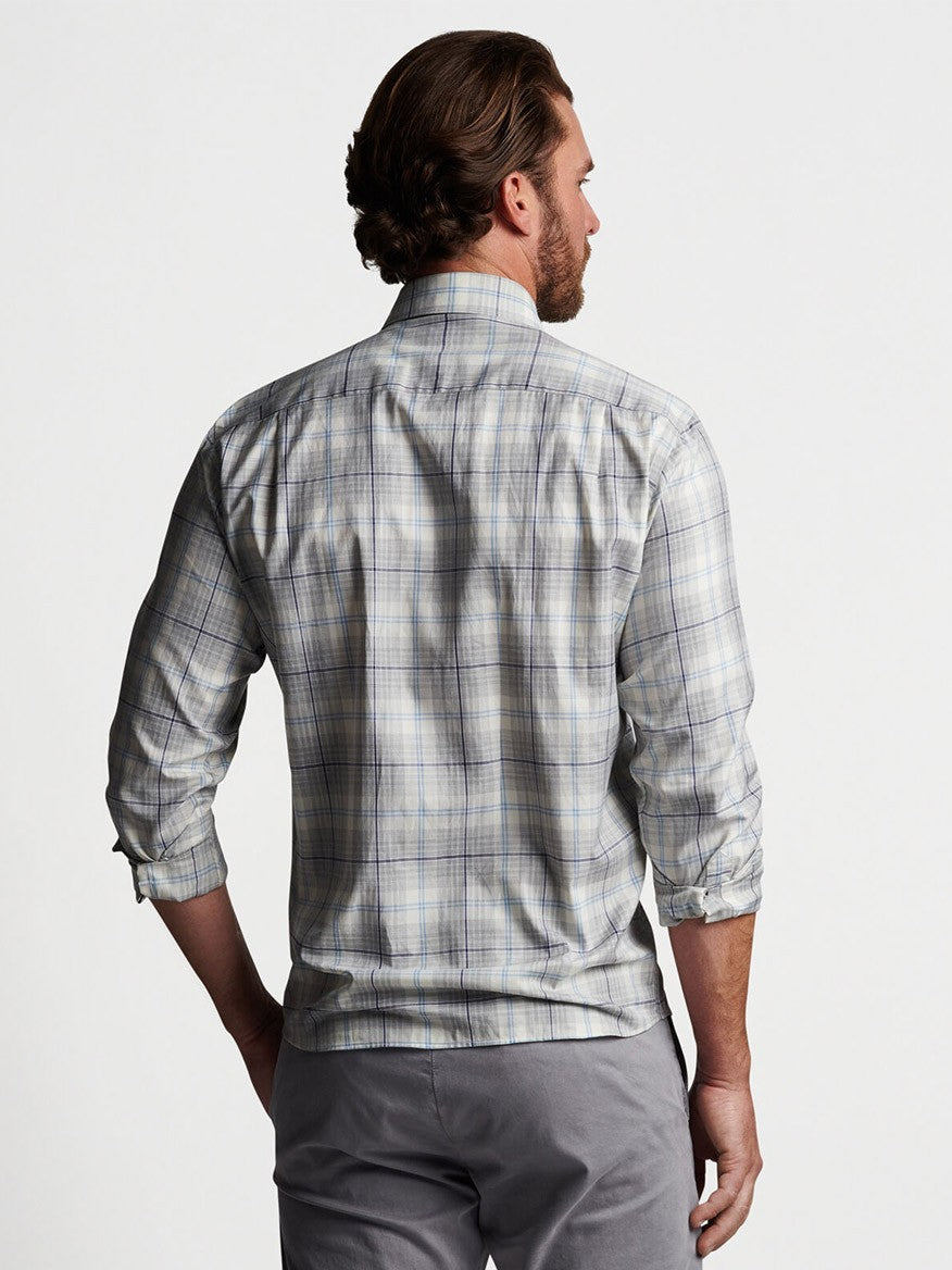 The back view of a man wearing a Peter Millar Axe Winter Soft Twill Sport Shirt in British Grey made of stretchy cotton fabric.