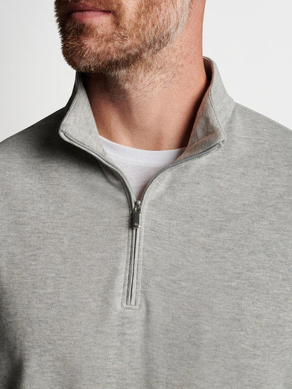 A man is wearing a Peter Millar Crown Comfort Pullover in Light Grey.