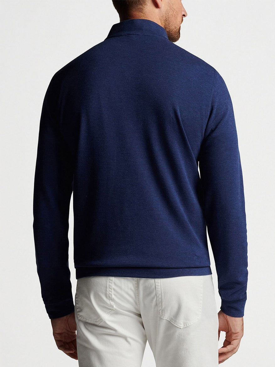 The back view of a man wearing a Peter Millar Crown Comfort Pullover in Navy sweater.