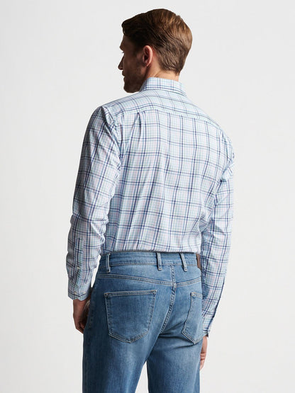 The back view of a man wearing cotton jeans and a Peter Millar Caspian Cotton Sport Shirt in Multi.