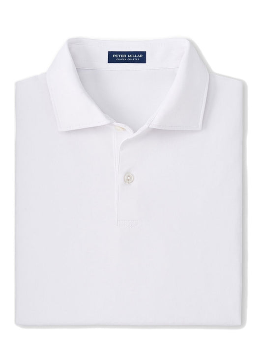 White lightweight folded Peter Millar Solid Performance Jersey Polo with visible brand label on collar.