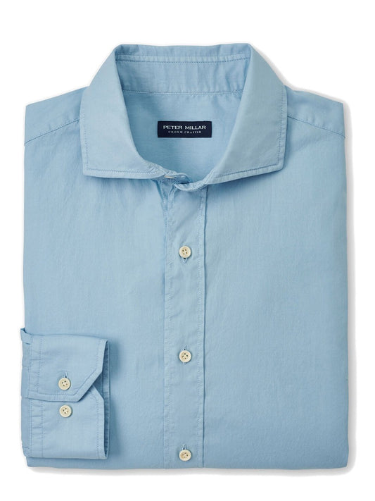 A neatly folded Peter Millar Sojourn Garment-Dyed Cotton Sport Shirt in Blue Frost.