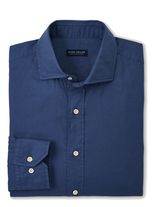 A neatly folded blue Peter Millar Sojourn Garment-Dyed Cotton Sport Shirt in Blue Pearl with visible buttons and collar.