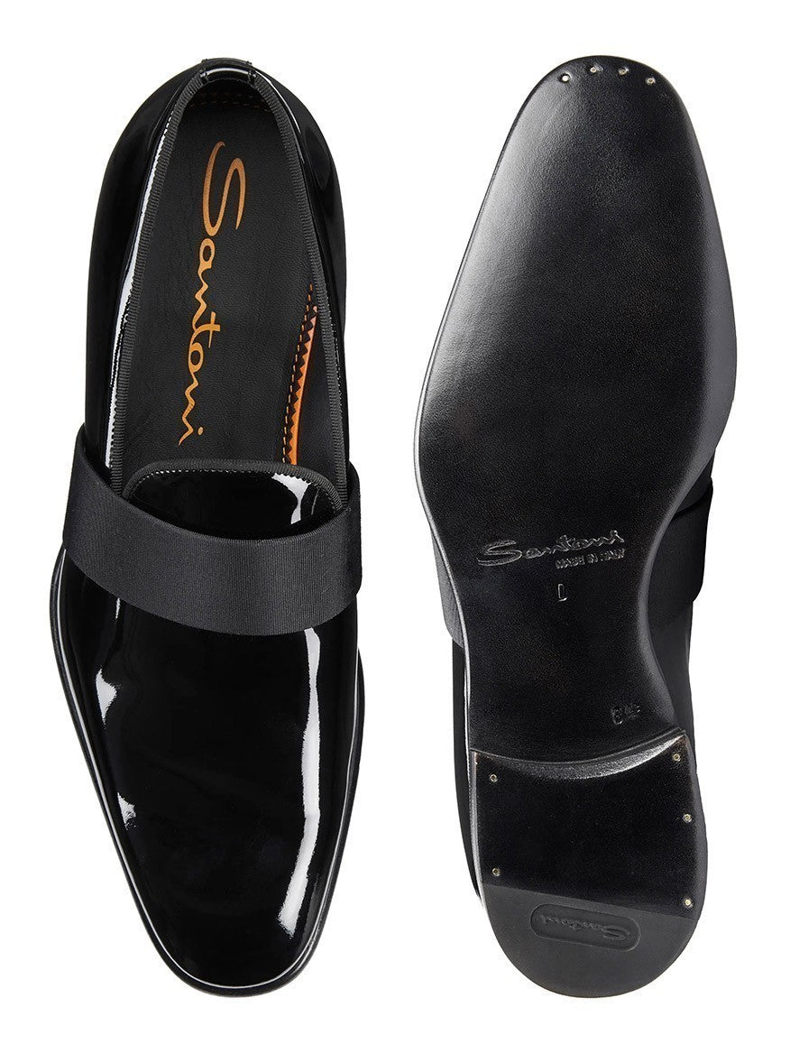 A pair of Santoni Isomer Formal Slip-On in Black Patent. The left Italian loafer is shown from the top, and the right shoe is shown from the bottom, displaying the sole and small metal studs near the heel.