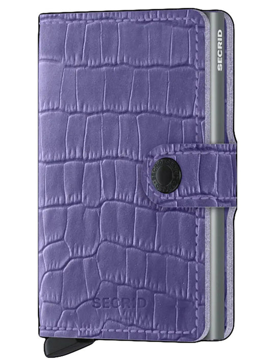 A Secrid Miniwallet Cleo in Lavender with a button clasp, embossed logo, and Cardprotector technology for wireless communication protection.