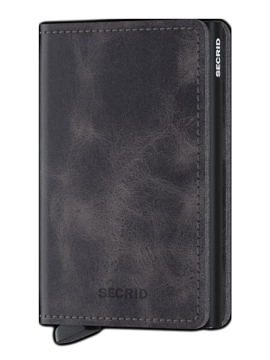 A Secrid Slimwallet Vintage in Grey-Black with a black leather cover.