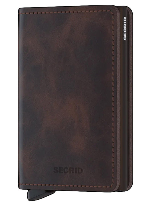 A brown leather Secrid Slimwallet Vintage in Chocolate with the word serid on it.