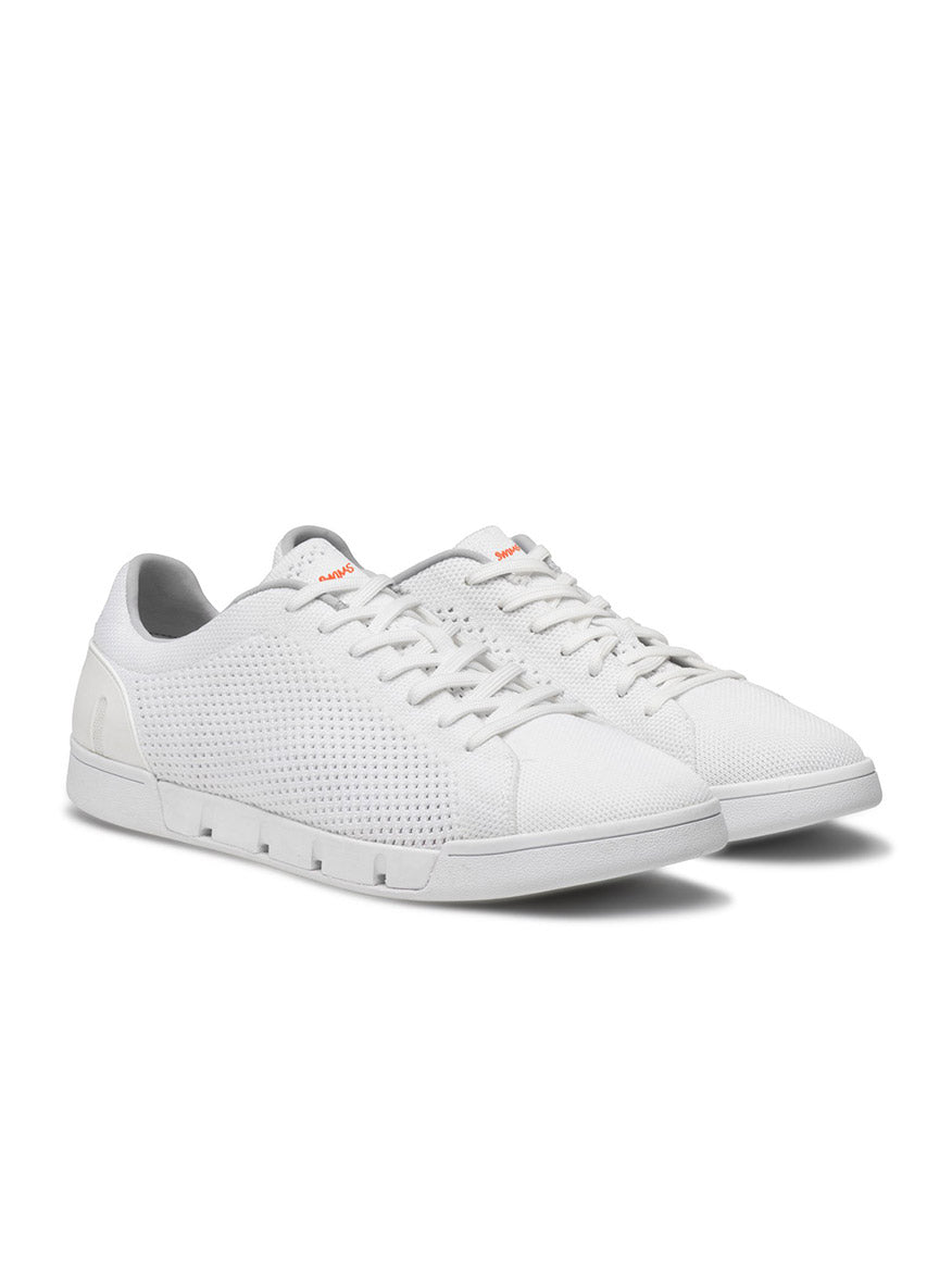 A pair of lightweight Swims Breeze Tennis Knit in White with perforated sides, white laces, and a low-top design, perfect for tennis.