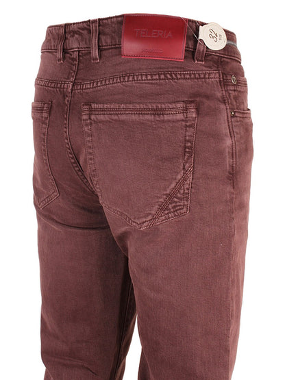 Teleria Zed Cobra Selvedge Stretch Denim in Mosto pants with back pockets and a brand label on the waistband.