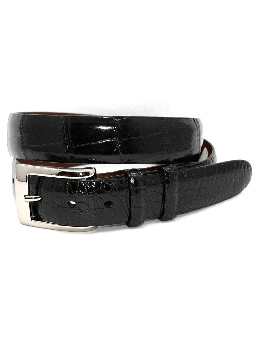 The Torino Leather American Alligator Skin Belt in Black, handcrafted in the USA, boasts a luxurious black leather with an alligator pattern and features a polished nickel buckle, meticulously coiled in a circular shape.
