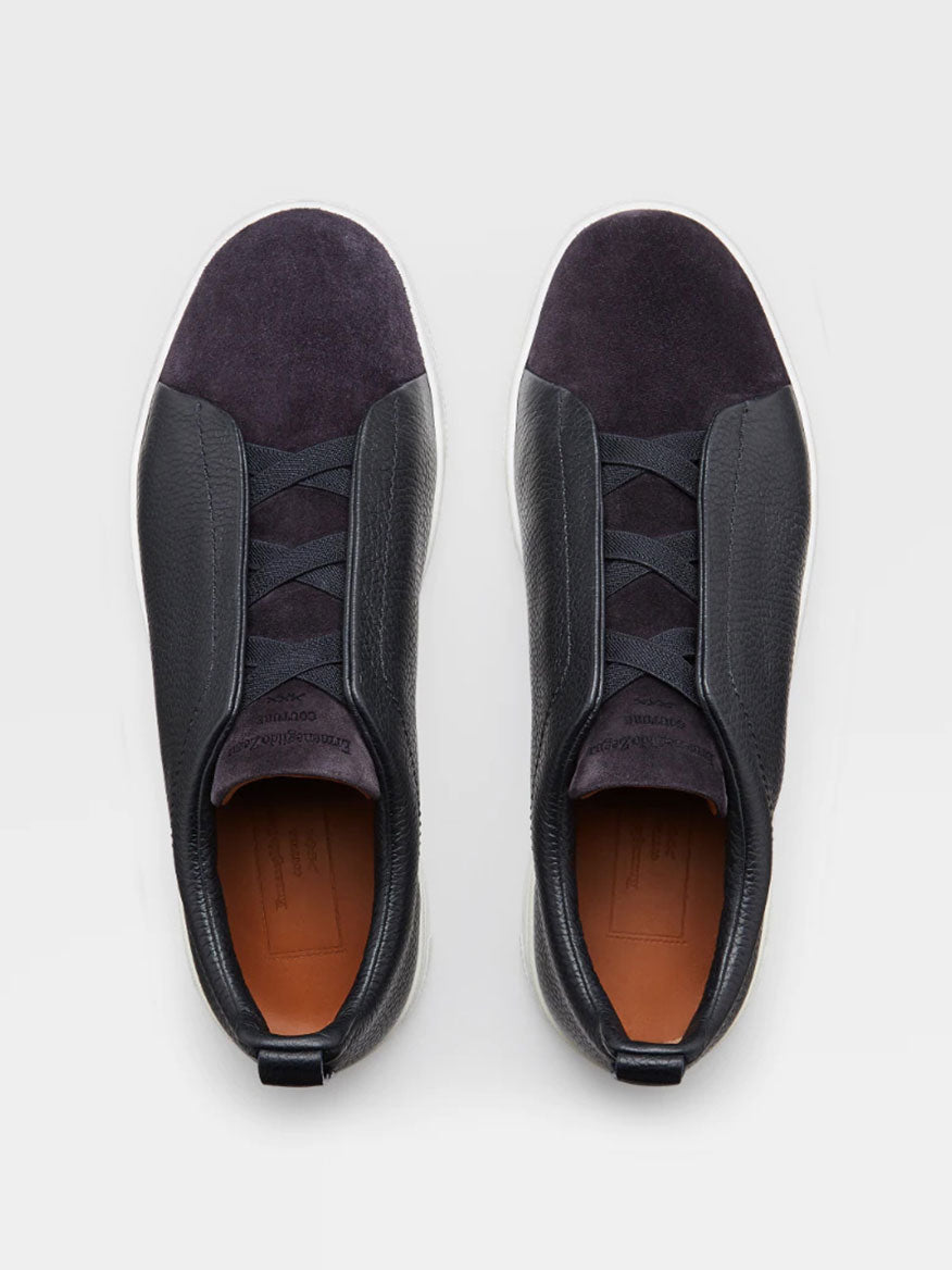 A pair of Zegna Navy Blue Grained Leather and Suede Triple Stitch™ sneakers with dark leather accents viewed from above, designed to be lightweight.