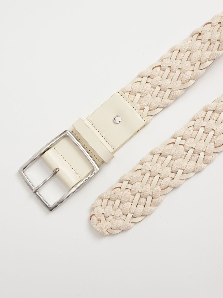 rag & bone Jumbo Boyfriend Woven Belt in Antique White with a silver, logo-engraved buckle on a white background.