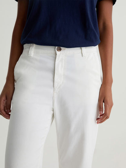 Model wearing the AG Jeans Caden Straight Leg Trouser in Powder, shown from shoulders to upper thighs against a plain background. The tailored fit showcases the comfort of Stretch Cotton Tencel Twill fabric.