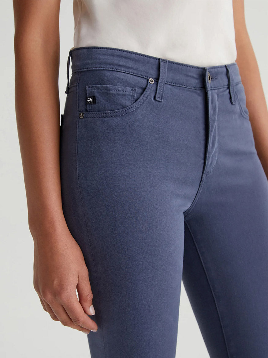 The back view of a woman wearing AG Jeans Prima Cigarette Leg in Blue Note with a fitted silhouette.