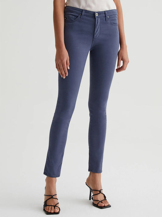 A woman wearing a pair of AG Jeans Prima Cigarette Leg in Blue Note.