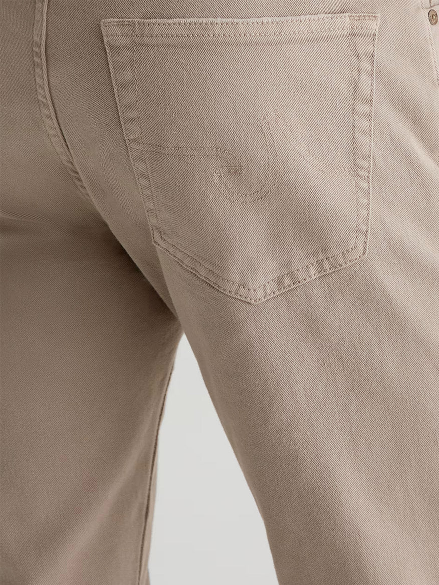 Close-up of the back pocket on AG Jeans Tellis in 7 Years Sulfur Stone Barrack, showcasing stitching details and the soft texture of Cloud Soft Denim.