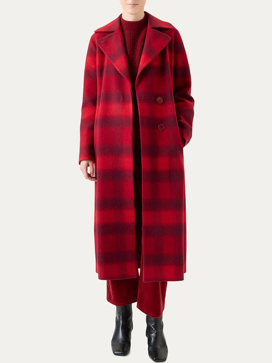 Person wearing the Akris Punto Blurred Check Belted Double-Breasted Coat in Cranberry/Blackberry over a coordinated red outfit with black ankle boots, standing against a plain light background.