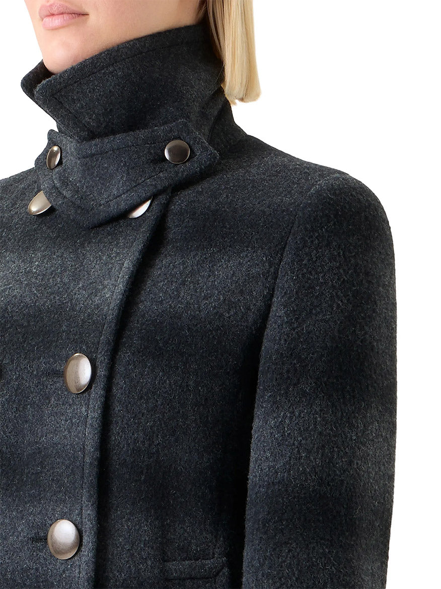 A person is shown from the shoulders up wearing the Akris Punto Blurred Check Wool Pea Coat in Charcoal/Black, a dark gray high-collared peacoat with large metallic buttons.