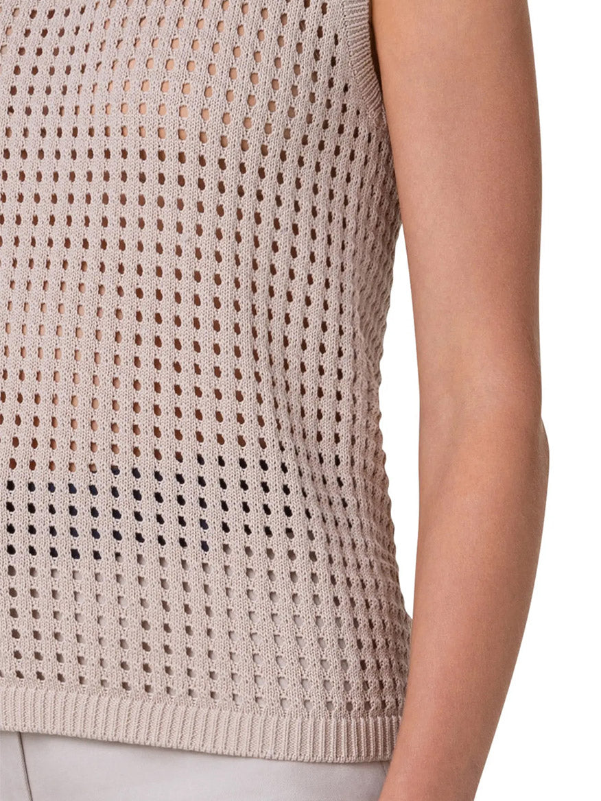 The woman is wearing an Akris Punto Chunky Mesh Scoop Neck Tank in Cashew, featuring an open mesh stitch.