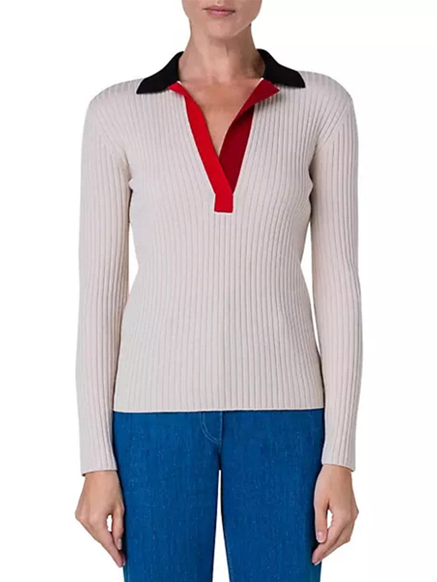 A woman wearing the Akris Punto Colorblock Rib Knit Polo in Cashew Multi in beige and red.