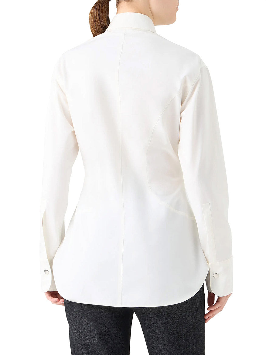 A person wearing the Akris Punto Poplin Cotton Cinched Waist Shirt in cream and black pants is shown from the back.