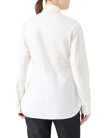 A person wearing the Akris Punto Poplin Cotton Cinched Waist Shirt in cream and black pants is shown from the back.