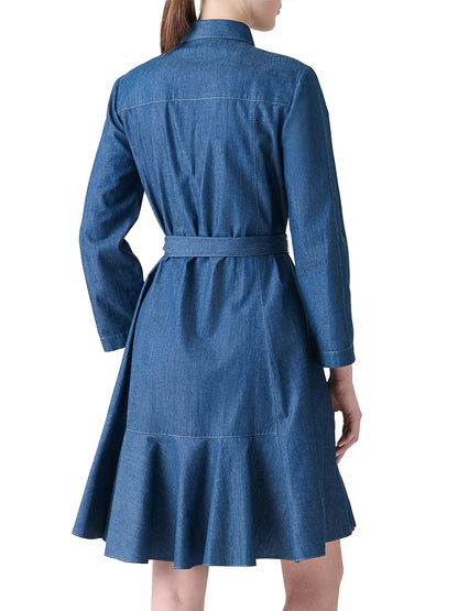 A woman is shown from behind wearing the Akris Punto Tie-Waist Denim Shirtdress in Medium Blue, featuring long sleeves, a belt, and an A-line silhouette.
