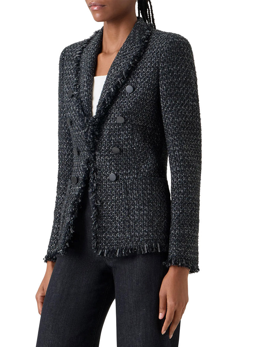 A person wears the Akris Punto Double-Breasted Fringed Tweed Jacket in Black/Stone with black pants and a white top.